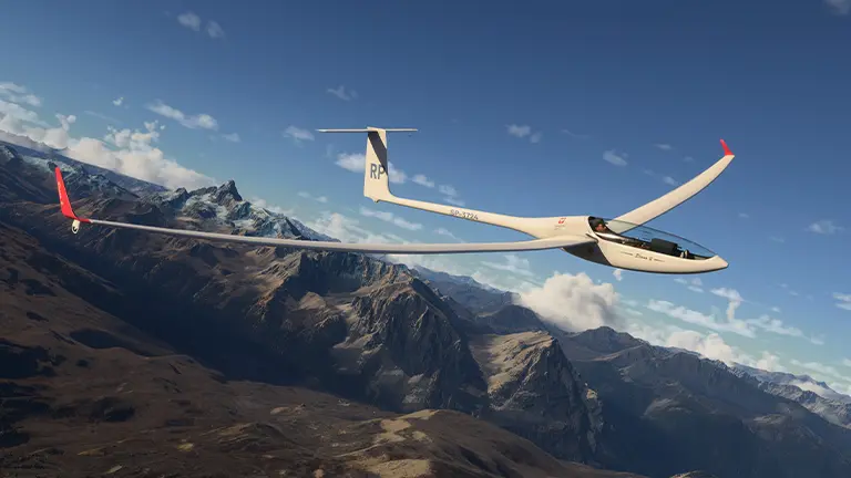 SZD-56-2 Diana 2 glider flying over the mountains